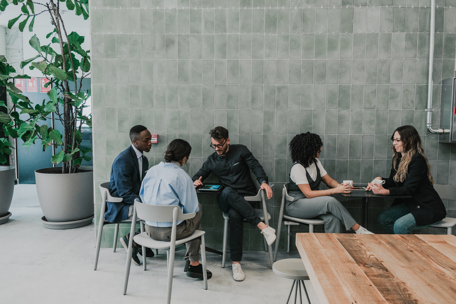 Colleagues reviewing work together at a table
