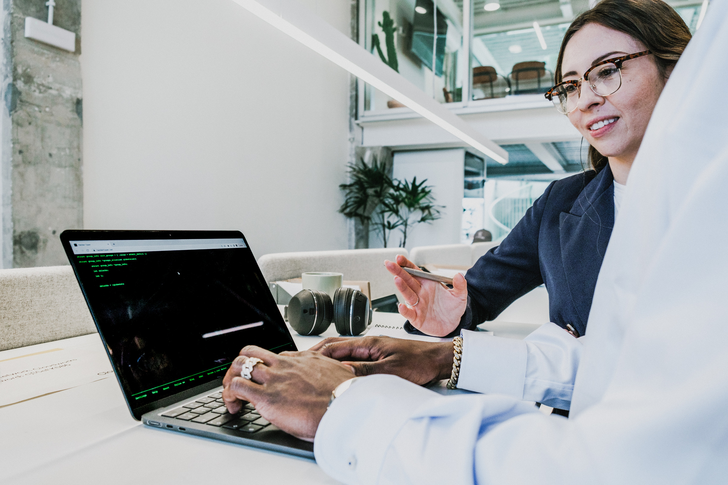 Two colleagues collaborating at a desk