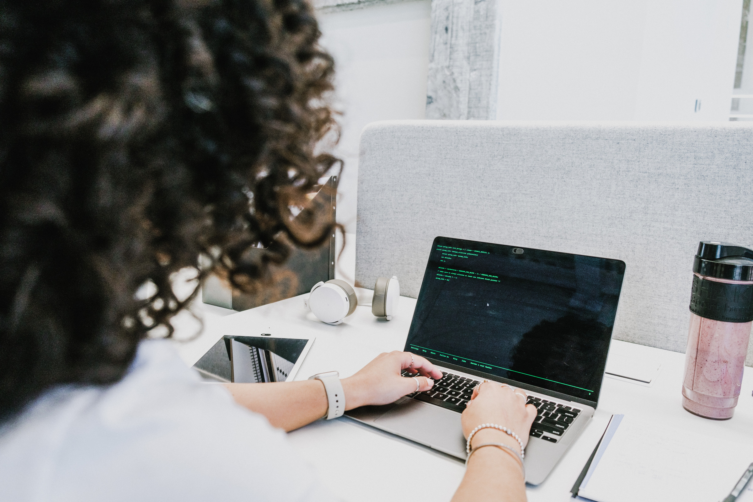 Analyst working with data on a laptop